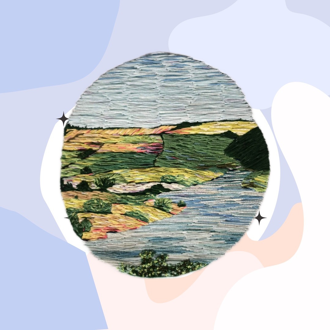 patchwork embroidery of a landscape in blues and greens